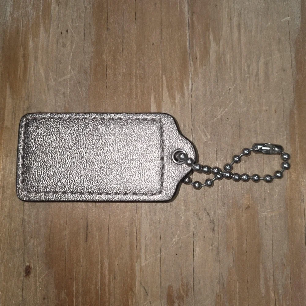 Coach bag tag